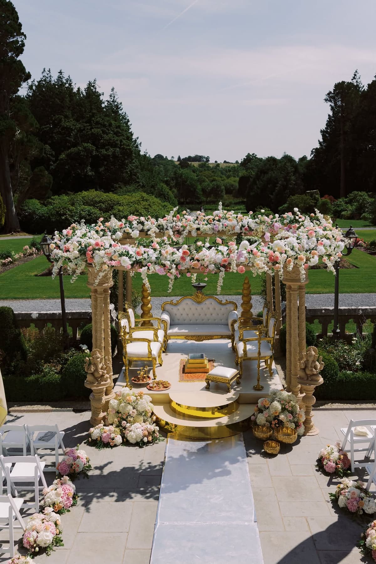 Floral mandap set within the gardens of an Irish estate