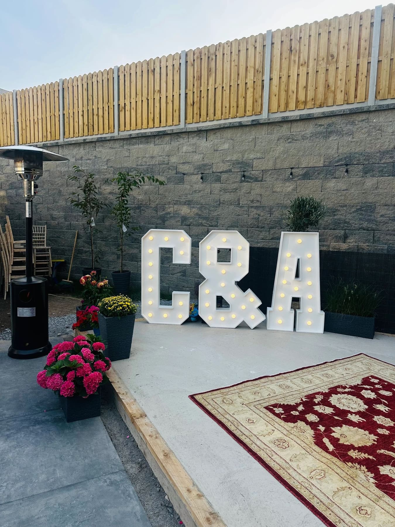 Illuminated reception letters with rug and floral styling